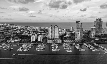 Marina in Miami Beach, Florida USA. Yacht boat docked on sea Biscayne bay. Downtown Miami Marina with luxury yacht boat. Summer vacation. Luxurious yacht marina. Luxury boat harbor. Aerial viewの写真素材
