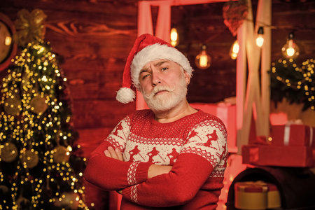 Christmas traditions. Stick to traditions. December sale. Knitted sweater. Celebrate new year. Man senior Santa claus wear sweater nordic pattern. Winter traditions. Santa Claus. Stylish elderly manの写真素材