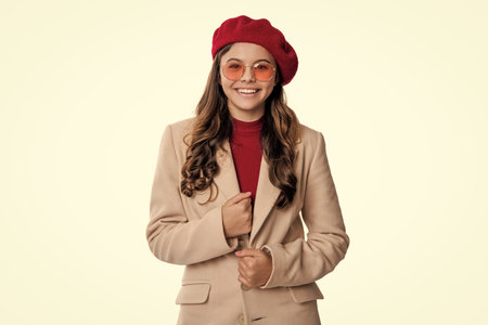 Girl in autumn style. Teen girl wear sunglasses. Autumn fashion girl isolated on white. Trendy and stylish girl smiling. Fall fashion style for teen. Outfit for fall style. Fall adolescence fashionの写真素材