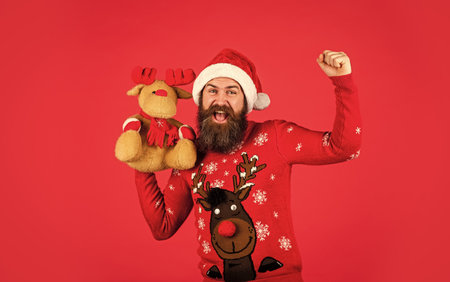 Christmas mood. its christmas time. happy bearded man in sweater. gifts and presents preparation....