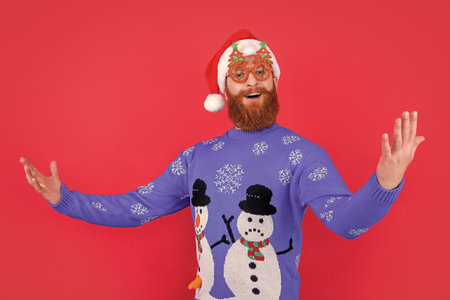 xmas party fun. singing man in party glasses have fun at xmas. santa man have fun at xmas partyの写真素材