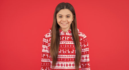 merry christmas. happy teen girl in red christmas clothes in studio. teen christmas girlの写真素材