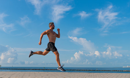 Sport runner do workout. Sport lifestyle with morning run. Runner man bare torso running. Sport and...