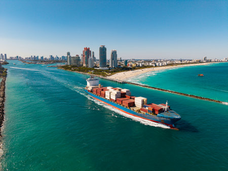 Aerial view cargo ship facing sea. Cargo business. Container ship. Shipping logistics. Commercial shipping. Cargo ship in sea, aerial view. Freight container loaded on cargo vesselの写真素材