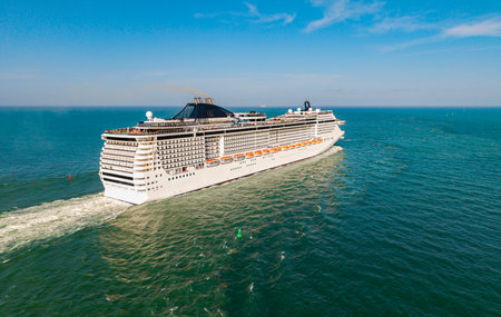 Travel at sea. Aerial drone view luxury liner. Ship leaving Miami port. Travel destination. Cruise ship vacation. Aerial cruise ship in vacation summer. Cruise ship vacation. Sea breezeの写真素材