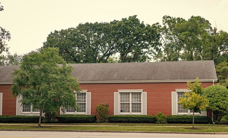 Home in suburb. Residential house. Suburban home in neighborhood. Private residential architecture dwelling. Suburban house architecture. Cozy suburban house. Architecture concept. Quiet neighborhoodの写真素材