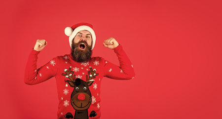 Are you ready. new year shopping idea concept. man in santa hat await christmas gift. hipster enjoy the holiday. morning before Xmas. bearded man in sweater. ready for party celebration. copy spaceの写真素材