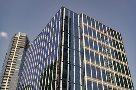 Skyscraper building architecture. Skyscraper with glassy facade. Modern city perspective. Skyscraper...