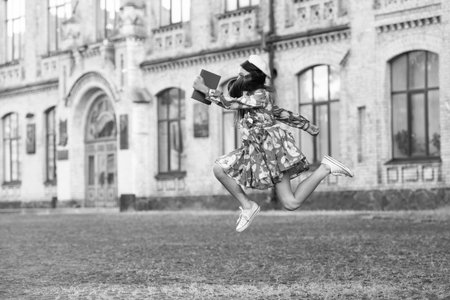 Time to study. Knowledge and education. School education. Students life. Teen girl jumping back to school. Knowledge day. Education in school. Girl student jump outdoor. September 1. Sale discountの写真素材