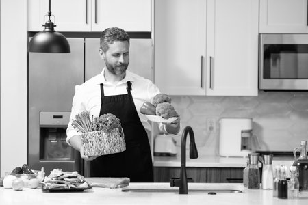 Millennial man cook healthy salad. Food diet. Man cook a tasty meal. Home menu with food ingredient....