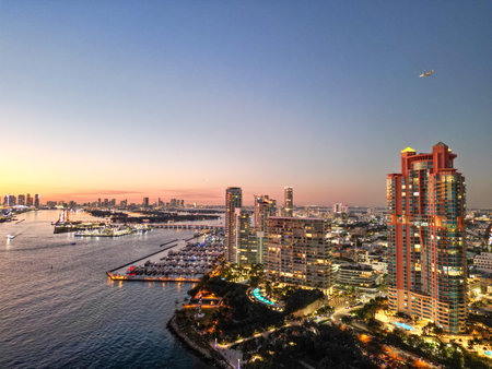 Aerial view of luxury yachts in Miami marina. Scenic panorama of boats and skyscrapers in Miami marina. Cruise yacht sailing along the Miami coastline. Miami Beach harbor. Sailboats and yachts at pier.の写真素材