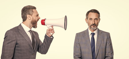 business promotion ideas by businessman shouting in loudspeaker isolated on whiteの写真素材