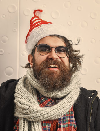 Homeless man celebrates Xmas. Merry Christmas. Santa Claus bearded man. Happy New 2025 Year. Xmas...