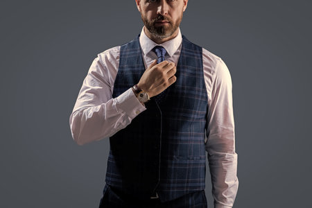 Formal suit vest with tie isolated grey. Gentleman menswear. Bespoke suit. Formal menswear concept....