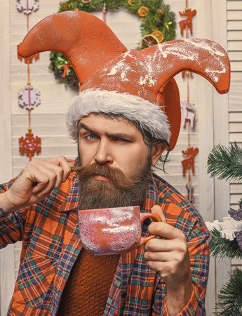 Santa man with moustache with mug. Delicious cocoa for Christmas. Man celebrate Xmas. Merry...