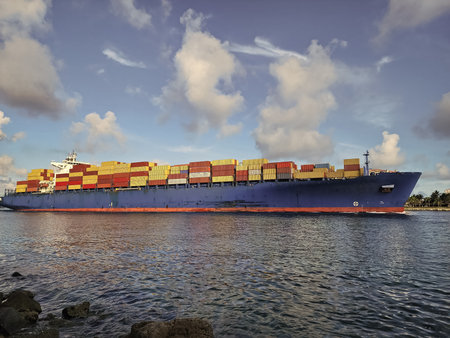 Cargo ship with container in Miami. Freight container loaded on cargo vessel in Miami. Aerial view...