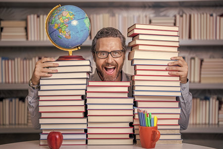 school teacher with book literature. education in school library. man bookworm getting knowledge....