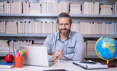 elearning education online with school teacher on laptop in classroomの写真素材