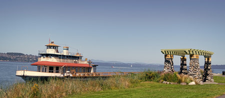 Touristic boat at sea marina. Ship boat in marina. Travel destination. Boat trip. Sea vacation on summer. Boating charter. Boat or ship for touristic route. Touristic tour destinationの写真素材