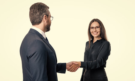 Professional successful businesspeople partner celebrating business success with handshake. partnership and business success. businesspeople isolated on white. successful business partnershipの写真素材