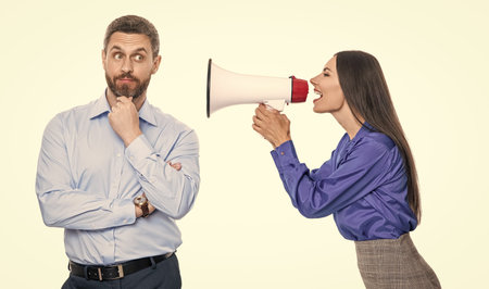 solving conflict. rivalry concept. business conflict. businesswoman shout on employee in loudspeaker isolated on white. business boss has conflict with partner about promotion. Promotional activitiesの写真素材