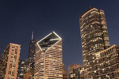 Business city. Night cityscape of Chicago skyscraper building. Chicago architecture of skyscraper. City night illuminated building. Skyscraper cityscape. Night city of Chicago. Vibrant atmosphereの写真素材