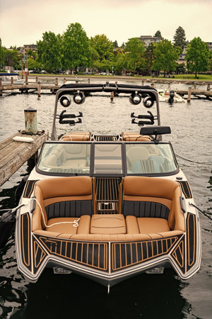 Luxury boat in marina. Yacht at sea marina. Luxury boat motor yacht in marina. Docked vessels. Boat trip. Yacht club. Sea vacation on summer. Boating and yachting charter. Summer vacationの写真素材