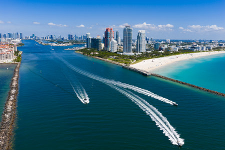 Yacht cruising near Miami Beach. Aerial view of boats on turquoise waters in Miami. Yacht retreat in South Florida Miami.の写真素材