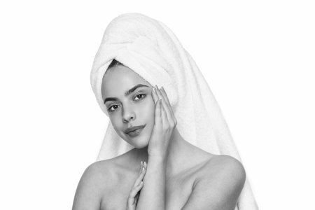 Beauty day in spa for young woman or girl having bright skin complexion doing skincare cosmetology isolated on whiteの写真素材