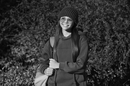 back to school. autumn girl carrying school bag. education for adolescence. teen girl in autumn park...