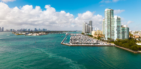 Aerial view of luxury yachts in Miami marina. Scenic panorama of boats and skyscrapers in Miami marina. Cruise yacht sailing along the Miami coastline.の写真素材