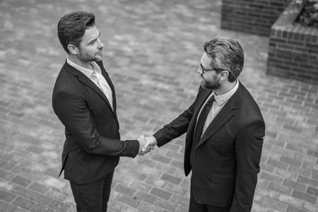 Businessmen dealing. Partnership concept. Handshaking. Business partnership. Business deal....