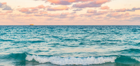 Sunrise with sea beach. Dramatic sunrise horizon at sea. Romantic summer vacation on sunset seascape. Sea sunset on ocean. Sunset seascape at summer vacationの写真素材