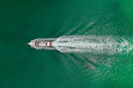 Sea boat go to yacht marina. Yachting and boating marina. Yacht boat sailing. Aerial view luxury...