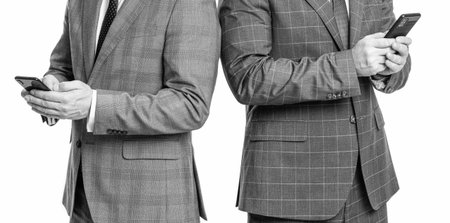 online business. business men in suit use phone. two texting businessmen chatting in blog....