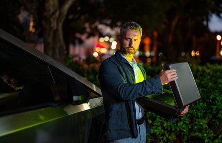 Successful business man at the parking. Success and confidence. Successful businessman with...