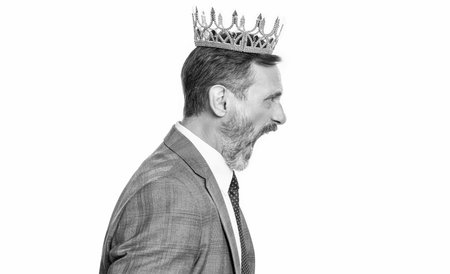 Successful angry businessman with crown. Business success and reward. Anger in business and...