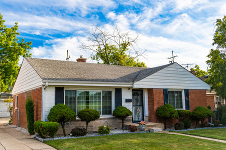 Suburb exterior with private housing. Suburban neighborhood. Private family home architecture. House exterior. Private house in suburban area. Suburban house architecture. Private ownershipの写真素材
