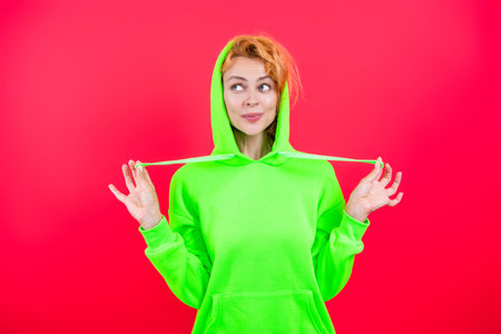 Fashion model. Redhead girl in stylish hoodie. Stylish Caucasian woman in casual hoodie. Fashionista...