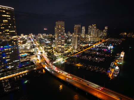 Night view. Yacht club. Marina in night. Summer vacation. Downtown city marina with luxury illuminated yacht. Docked vessels. Luxury yacht in night marina. Luxury yacht at nightの写真素材
