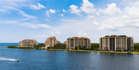 Aerial night view of Miami coastline. Twilight skyline above the Miami oceanfront. Miami Beach waterfront with dramatic sky.の写真素材