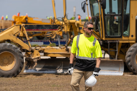 Man at construction site. Civil construction engineering. Man engineer at building site. Supervisor...