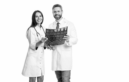 doctor neurologist with xray scan. doctor in hospital looking at xray film healthcare, roentgen. medic in gown hold xray brain by radiographic. doctor hold xray isolated on white. MRI appointmentの写真素材