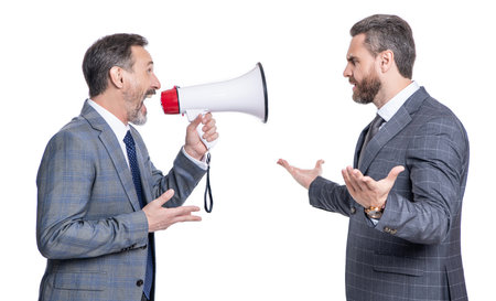 business idea promotion. businessman in suit with megaphone isolated on white. business man promoter solving promotional conflict. businessman promoting idea for business. promotion and conflictの写真素材