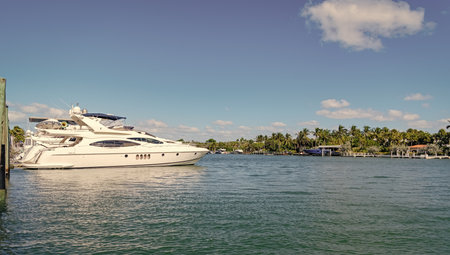 Sea vacation on summer. Luxury boat motor yacht in marina. Luxury yacht. Boating and yachting tourism. Luxurious life. Vacation on summer. Docked yacht at private area. Boat trip. Copy space bannerの写真素材