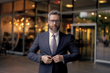 Business boss man getting ready for meeting. Successful business. Success of entrepreneur. Office manager. Businessman outdoor. Businessman in suit. Mature Hispanic businessmanの写真素材