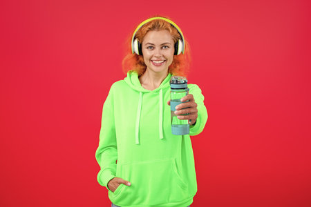 Woman thirst. Fitness and sport. Runner girl with bottle of water. Hydrate your body. Water balance...