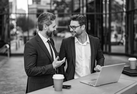 freelancer men have business online outdoor. freelancer men have business online with laptop.の写真素材