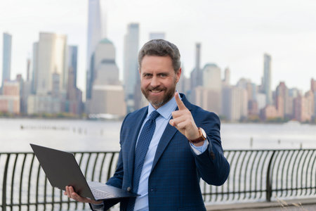 Businessman of Manhattan. Hispanic business man working online outdoor. Business executive remote...
