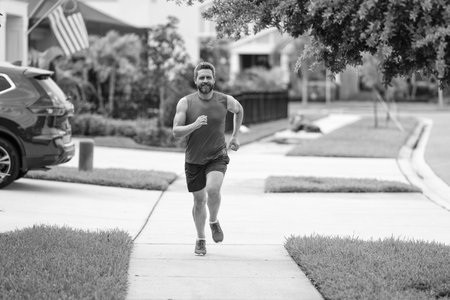 The running man enjoys the freedom of running outdoor. american runner. The running man feels sense...